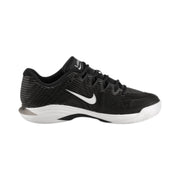 Black athletic shoe with white swoosh logo on a black background Nike Vapor 12 HC womens