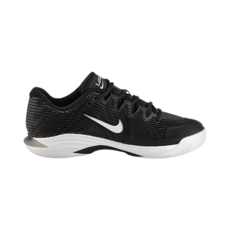 Black athletic shoe with white swoosh logo on a black background Nike Vapor 12 HC womens