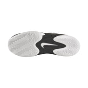 Black athletic shoe with white swoosh logo on a black background and a white outsole Nike Vapor 12 HC womens