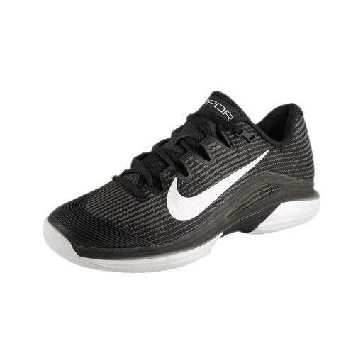 Black athletic shoe with white swoosh logo on a black background Nike Vapor 12 HC womens